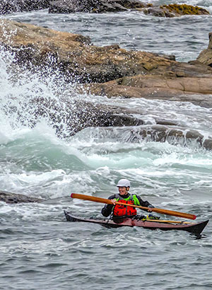 sea kayaking near rocks